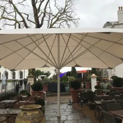 Commercial Parasols UK Aztec Extreme UK Parasols on large patio