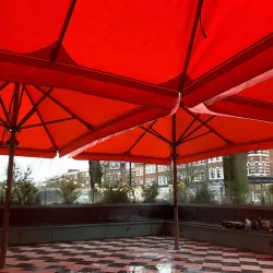 Bespoke size designer shading umbrellas on a tiled terrace in belsize park london Outdoor living alfresco style umbrellas in Belsize Park London