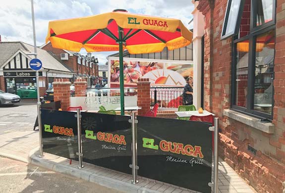 Mexican restaurant Umbrella and glass panels and stainless steel posts